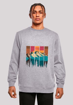 Gray sweatshirt featuring a graphic of mountains and trees in teal, orange, and pink. The design includes vertical color blocks and a crew neck.