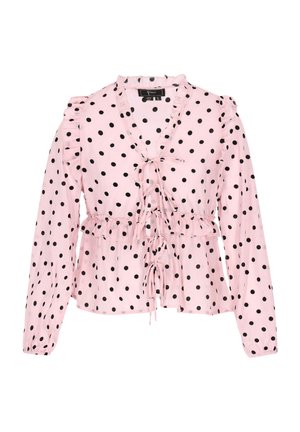 Rozā garām piedurknēm blūze ar melniem punktiņiem, ar viļņainiem pleciem, ar sasienamu priekšu un pepluma jostasvietu. Gluda auduma tekstūra.