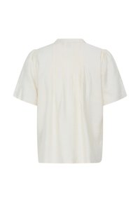 Blouse crème à manches courtes, coupe ample, col montant avec de subtils plis dans le dos, présentée sur fond blanc.