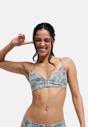 Dreieck-Bikinioberteil in Schwarz-Weiß mit Blattmuster, ausgestattet mit dünnen Trägern und einem gerafften Mittelpunkt. Glatter Stoff mit dezentem Glanz.