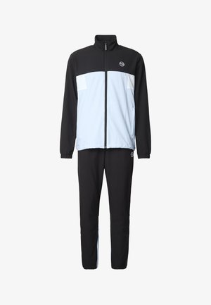 Tuta bicolore nero e azzurro chiaro con giacca a zip intera e polsini elastici, con piccolo logo bianco sul petto e sulla coscia.