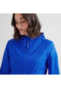 Blue lightweight jacket with a hood, featuring a front zipper and flat seams. Branded "TOG24" on the upper left side. Smooth texture.