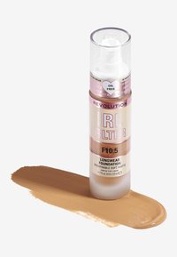 Revolution IRL Filter Fond de Teint de Larga Duración en tono F10.5. Botella de plástico transparente con dispensador, líquido de un tono claro de bronceado salpicado abajo, acabado mate.