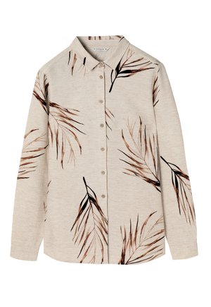 Knappe skjorte i lys beige stof med brune og sorte bladmønstre. Har en spredt krave og lange ærmer.