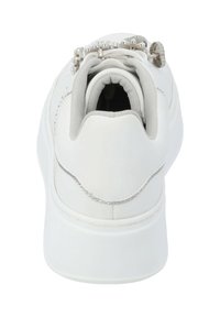 White sneaker with rounded shape, smooth synthetic upper, grey fabric lining, and decorative metallic accents on the laces.
