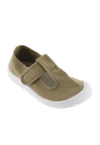 Scarpa in tela marrone chiaro con suola in gomma bianca, dotata di una cinghia in Velcro e un design ritagliato sui lati per garantire traspirabilità.