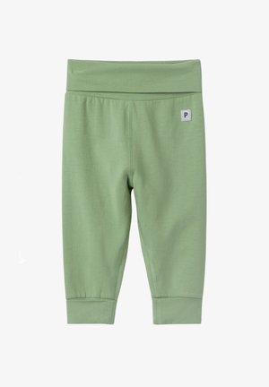 Leggings bébé en tissu doux vert clair avec une large ceinture, des revers pliés et un petit patch logo carré sur le côté droit devant.