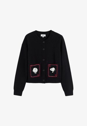 Black cardigan featuring two pockets with illustrations of cartoon characters, Charlie Brown and Snoopy, framed by red stitching.