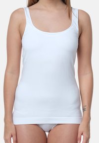White cotton tank top with wide shoulder straps, scoop neckline, and a fitted style. Smooth texture with no visible patterns or accents.