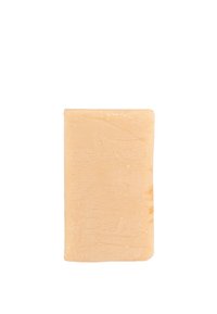 Barra di sapone rettangolare beige con una superficie leggermente texture, fotografata su uno sfondo bianco.