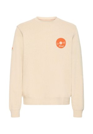 Sweat-shirt beige à manches longues, col rond, et poignets côtelés. Présente un graphisme circulaire orange avec le texte "Blend" sur la poitrine.