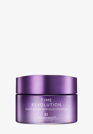 Lilla krukke med Time Revolution Night Repair Ampoule Cream 5X, 50 ml, med hvit tekst på en ensfarget hvit bakgrunn.