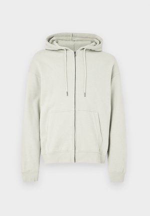 Felpa con cappuccio grigio chiaro con cerniera, realizzata in morbido cotone, dotata di una tasca frontale spaziosa, cappuccio con coulisse regolabile e polsini e orlo a costine.