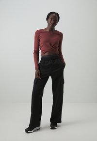 Champion EMOTIONAL DANCE WIDE LEG CARGO PANTS - Treniņtērpa apakšdaļas - black