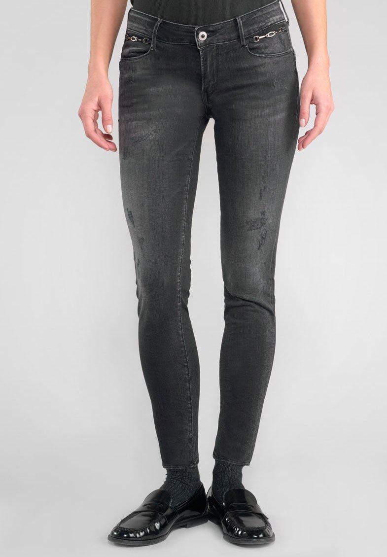 Zwarte skinny jeans met een vervaagde textuur, voorzakken met metalen accenten en een slim fit van taille tot enkel.