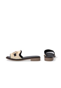 Woven straw slip-on sandals with a black leather trim, gold buckle detail, and a low, wooden block heel.
