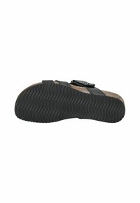 Sandalo nero con cinturini regolabili, soletta in sughero e suola in gomma testurizzata con motivi a onda. Design piatto per comfort e stabilità.