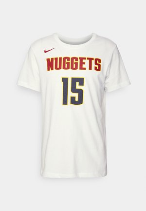 White cotton t-shirt featuring "NUGGETS" in red and "15" in blue with a mesh pattern, and a small red Nike logo on the left shoulder.