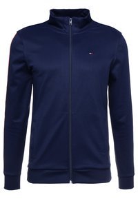 Navy zip-up athletic jacket made of smooth fabric; features stand-up collar, long sleeves, and minimal logo accent on the chest.