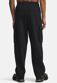 Black cargo pants made of lightweight fabric with an elastic waistband, featuring side pockets and a relaxed fit.