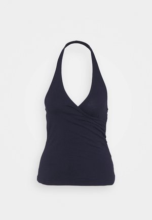 Granatowy bezrękawnik na szyję z dekoltem w kształcie litery V i marszczonym detalem z przodu, wykonany z miękkiej, elastycznej tkaniny.