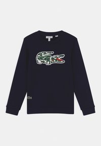 Felpa navy in cotone, con un grande logo di coccodrillo ricamato in verde e rosso sul petto e un piccolo logo sull'orlo.