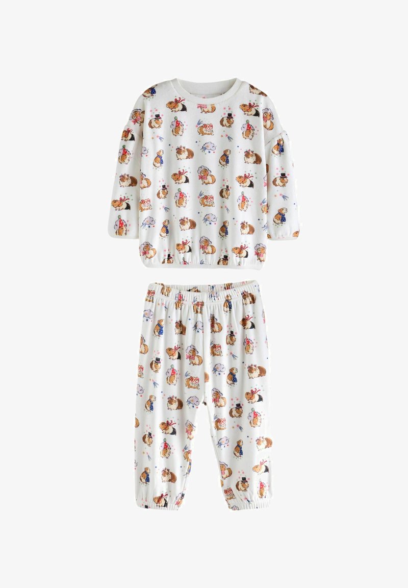 Set di pigiama bianco in cotone composto da una maglietta a maniche lunghe e pantaloni, decorato con stampe di animali dei cartoni animati colorate, con polsini e vita elastici.