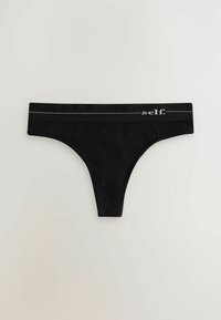 Schwarze String-Unterwäsche aus einem weichen Stoff, mit einem breiten Bund, der ein kontrastierendes Logo und ein minimalistisches Design aufweist.
