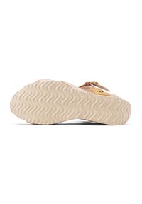 Sandalo beige chiaro con suola in gomma texturizzata, caratterizzato da un motivo ondulato e due cinghie regolabili. La suola è leggermente rialzata per il massimo comfort.