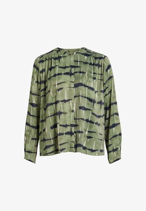 Blouse verte à coupe décontractée, ornée de motifs abstraits en noir et blanc, en tissu doux, à manches longues et à col rond.