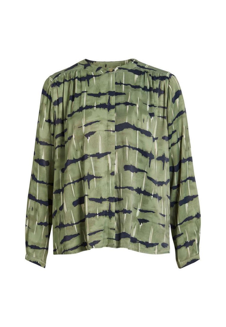 Blouse verte à coupe décontractée, ornée de motifs abstraits en noir et blanc, en tissu doux, à manches longues et à col rond.