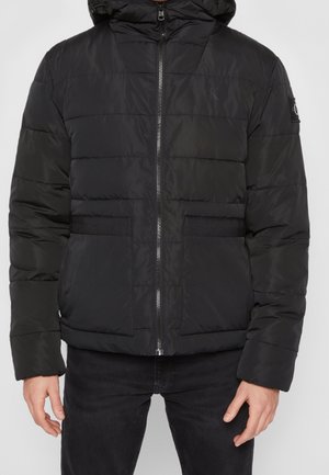 Black puffer jacket with a hood, featuring quilted pattern, front zipper, and two large side pockets. Textured fabric with elastic detailing.