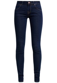Jeans skinny de denim azul oscuro con un diseño ajustado, cinco bolsillos y acentos de costura dorada. Presenta un cierre de botón estándar.