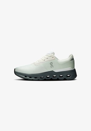 Men's running shoes in light gray with a textured upper, white accents, and a cushioned black sole featuring cut-out designs for flexibility.