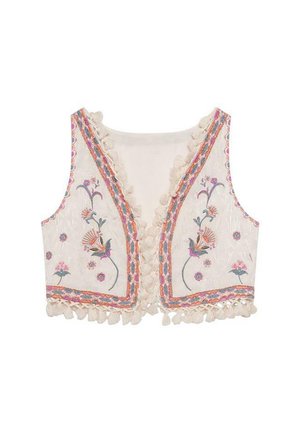 Chaleco bordado en tela color crema con diseños florales. Presenta adornos coloridos y acentos de pompones a lo largo de los bordes. Diseño de frente abierto.