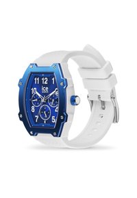 Reloj con caja octagonal azul y correa de silicona blanca, con una esfera azul, números blancos, tres subesferas y acentos metálicos.