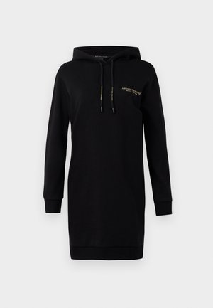 Zwart sweatshirtjurk met een capuchon. Gemaakt van zachte stof. Heeft lange mouwen, geribde manchetten en een klein gouden logo op de borst.