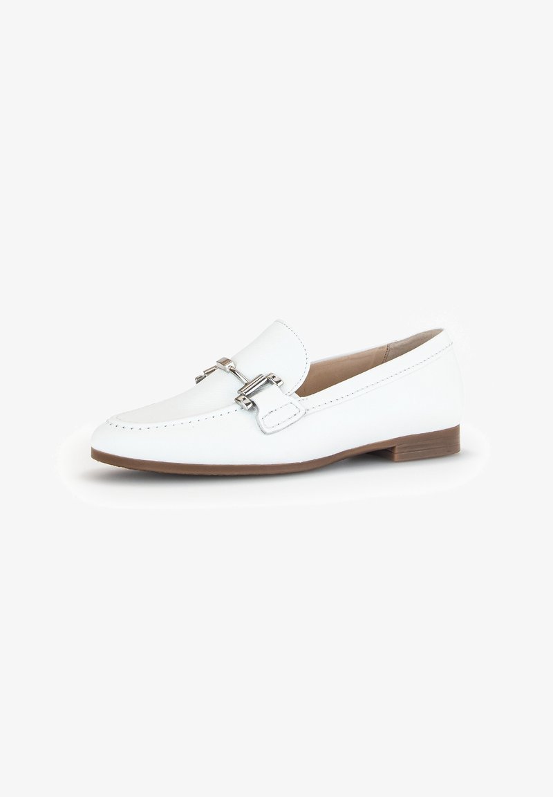 White leather loafers with a flat sole and a decorative silver buckle. Rounded toe and contrasting stitching detail. Soft texture on surface.