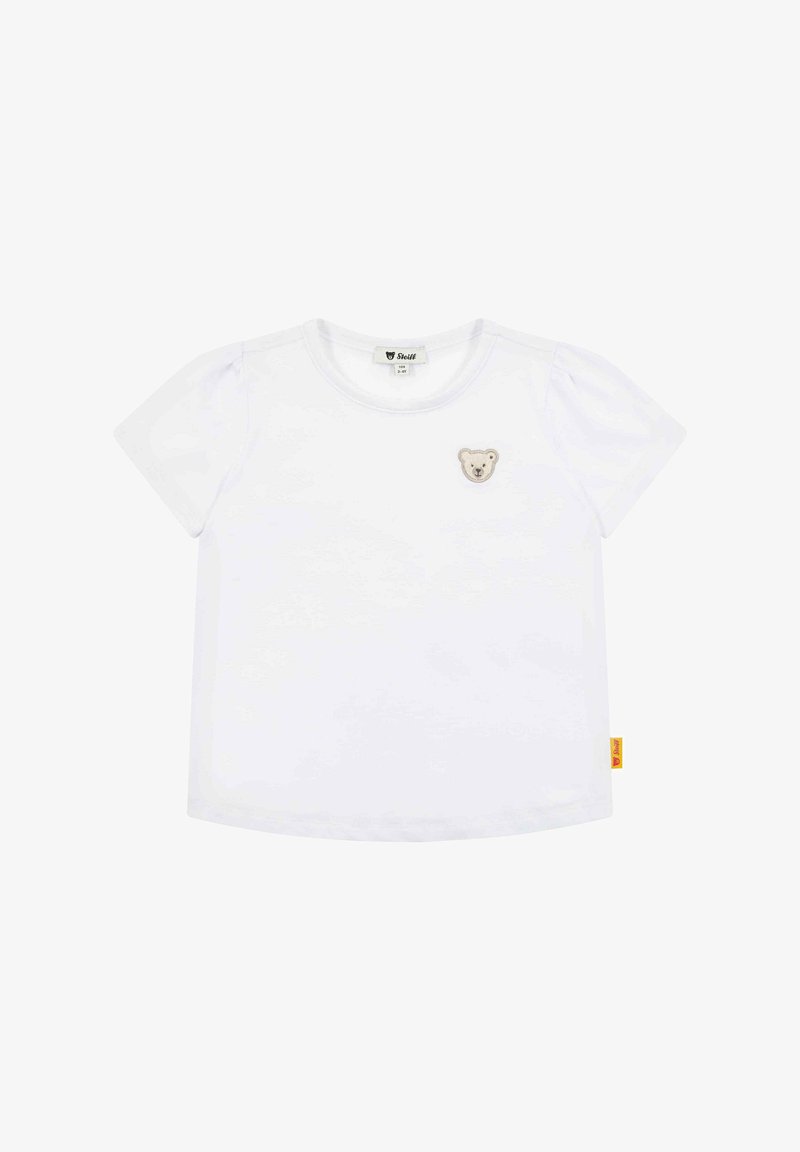 Biała bawełniana koszulka z krótkim rękawem, z małym haftowanym wzorem misia na lewej piersi oraz żółtą metką z boku.