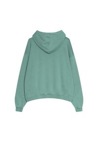 Huvtröja i ljus teal-färg, tillverkad av mjukt tyg. Har en lös passform, sänkta axlar och ribbade mudd och nederkant.