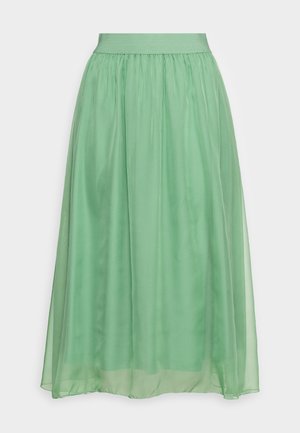 Lunga gonna verde realizzata in materiale trasparente e fluido. Presenta una vita elastica arricciata e una consistenza morbida e leggera.