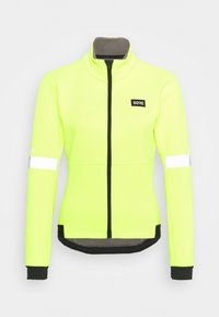 Ljust gul cykeljacka med hög krage, full dragkedja, reflektande detaljer och svarta ärmslut och fåll. Har GORE-logotyp.