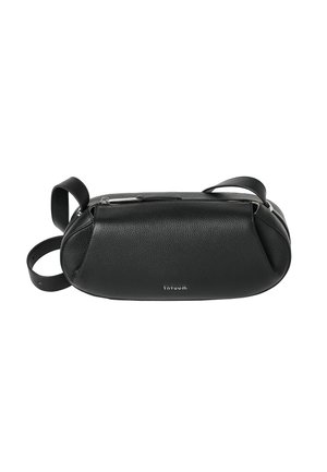 Black leather crossbody bag with adjustable strap, zipper closure, and "TANTUUM" brand name on the front.