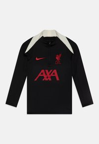 Crni atletski dugi rukav s visokim ovratnikom, crvenim Liverpool FC logotipom, crvenim Nike swoosh-om i bijelim naglascima na ramenima, s prednim patentnim zatvaračem.