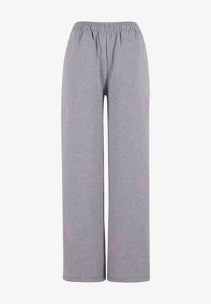 Graue Sweatpants mit elastischem Bund, die eine lockere Passform bieten. Kleines pinkes, gesticktes Logo auf jeder Seite. Hergestellt aus weichem Baumwollmaterial.