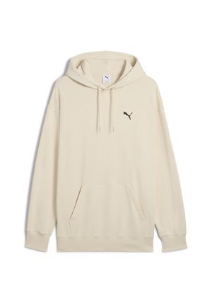 Beige hoodie i mjukt tyg med en framficka, dragsko på huvan och en svart Puma-logotyp på vänster bröst.