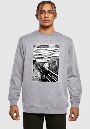 Grå sweatshirt med "The Scream" kunstværk i sort og hvid, præsenteret tydeligt i midten. Blødt stof med en afslappet pasform.