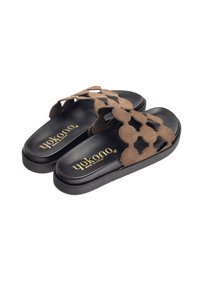 Brown suede slip-on sandals with a black rubber sole. Features cut-out design and gold branding on the footbed.