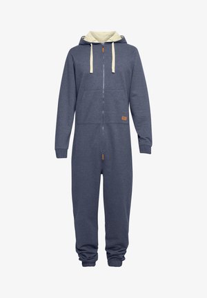 Granatowy polarowy kombinezon z kremowym kapturem, z przodu na zamek, z kieszeniami. Rękawy i kostki są elastyczne; posiada małą brązową metkę z logo.