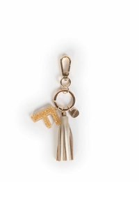 Portachiavi con una lettera "T" in glitter oro, un pon-pon in pelle beige e una clip in metallo dorato; presenta un anello rotondo e un ciondolo con logo.